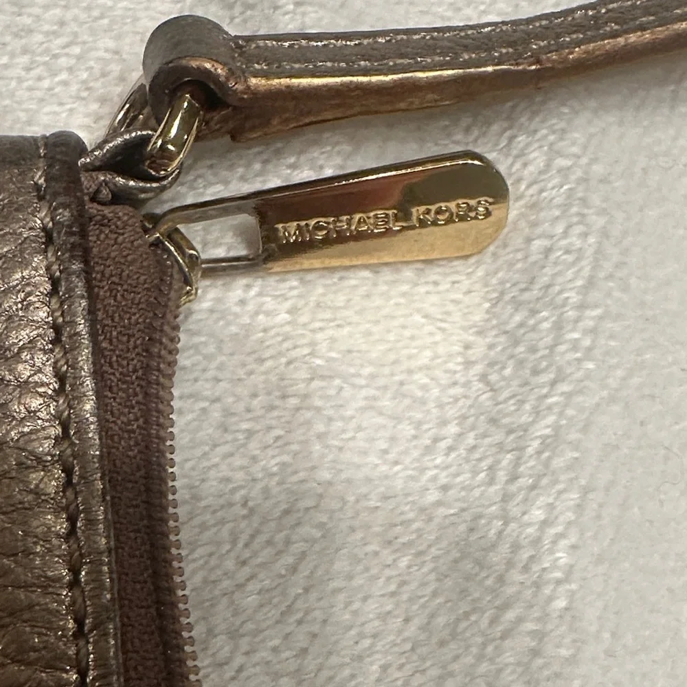 Michael Kors Shimmering Gold Wristlet‎